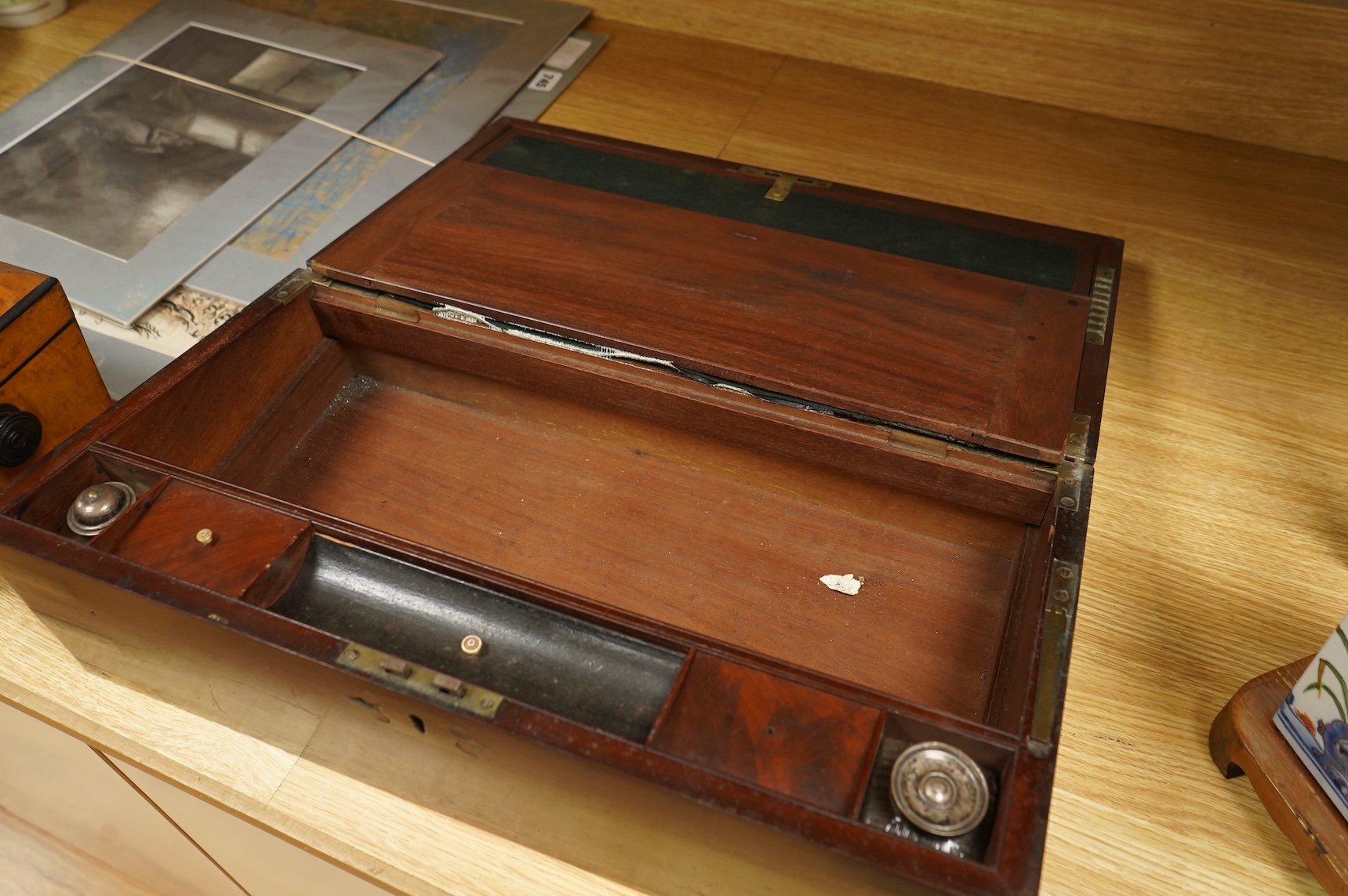A bird’s-eye maple tea caddy and a brass mounted writing slope, latter 50cm wide